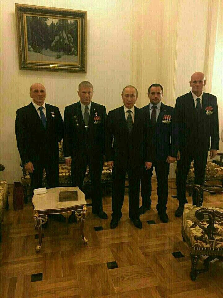  Vladimir Putin with Col. Andrey Troshev (second from left), sporting a fresh Hero of Russia award, and Col. Dmitry Utkin (far right), wearing four Bravery orders.